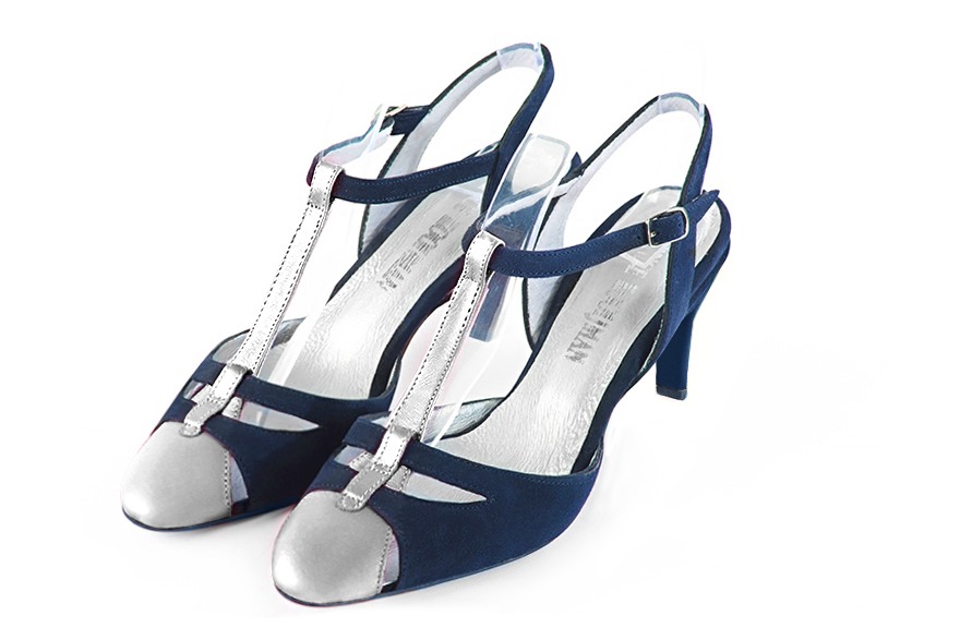 French elegance and refinement for these light silver and navy blue dress open back T-strap shoes, 
                available in many subtle leather and colour combinations. Its comfortable fit will accompany you until the end of the night.
Its charming, playful cutout gives you plenty of customization options.  
                Matching clutches for parties, ceremonies and weddings.   
                You can customize these shoes to perfectly match your tastes or needs, and have a unique model.  
                Choice of leathers, colours, knots and heels. 
                Wide range of materials and shades carefully chosen.  
                Rich collection of flat, low, mid and high heels.  
                Small and large shoe sizes - Florence KOOIJMAN